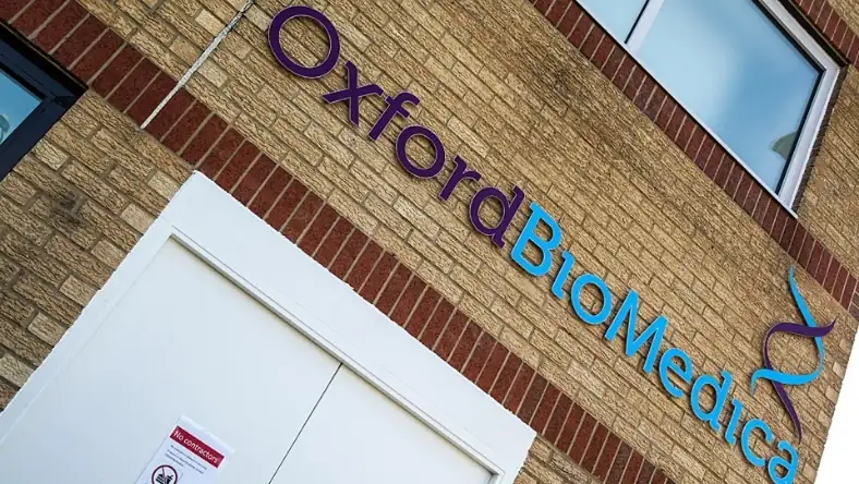Oxford Biomedica company signage on brick building exterior